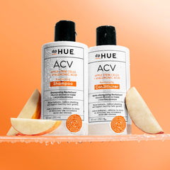 Foamy lather shot from dpHUE ACV Revitalizing Shampoo indicating gentle exfoliation.
