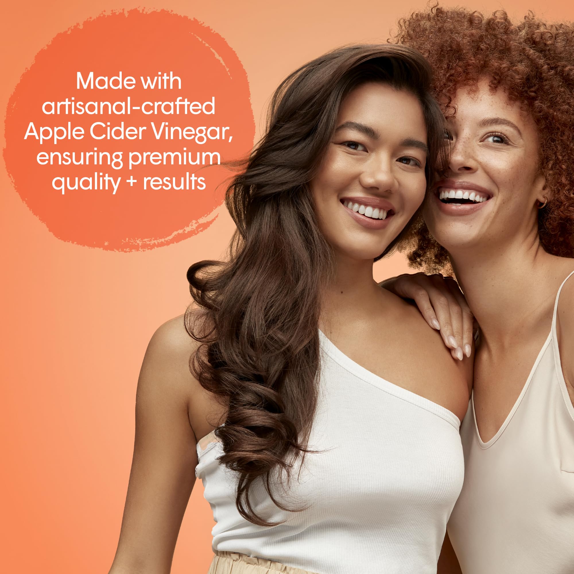 Natural ingredients closeup featuring apple cider vinegar, hyaluronic acid, and apple stem cells.
