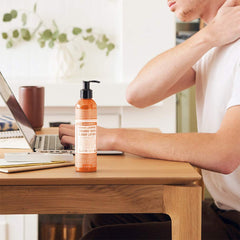 Dr. Bronner's Orange Lavender lotion being used on hands and face