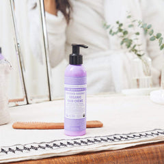 Dr. Bronner's Organic Hair Creme applied to ends for smooth moisture.
