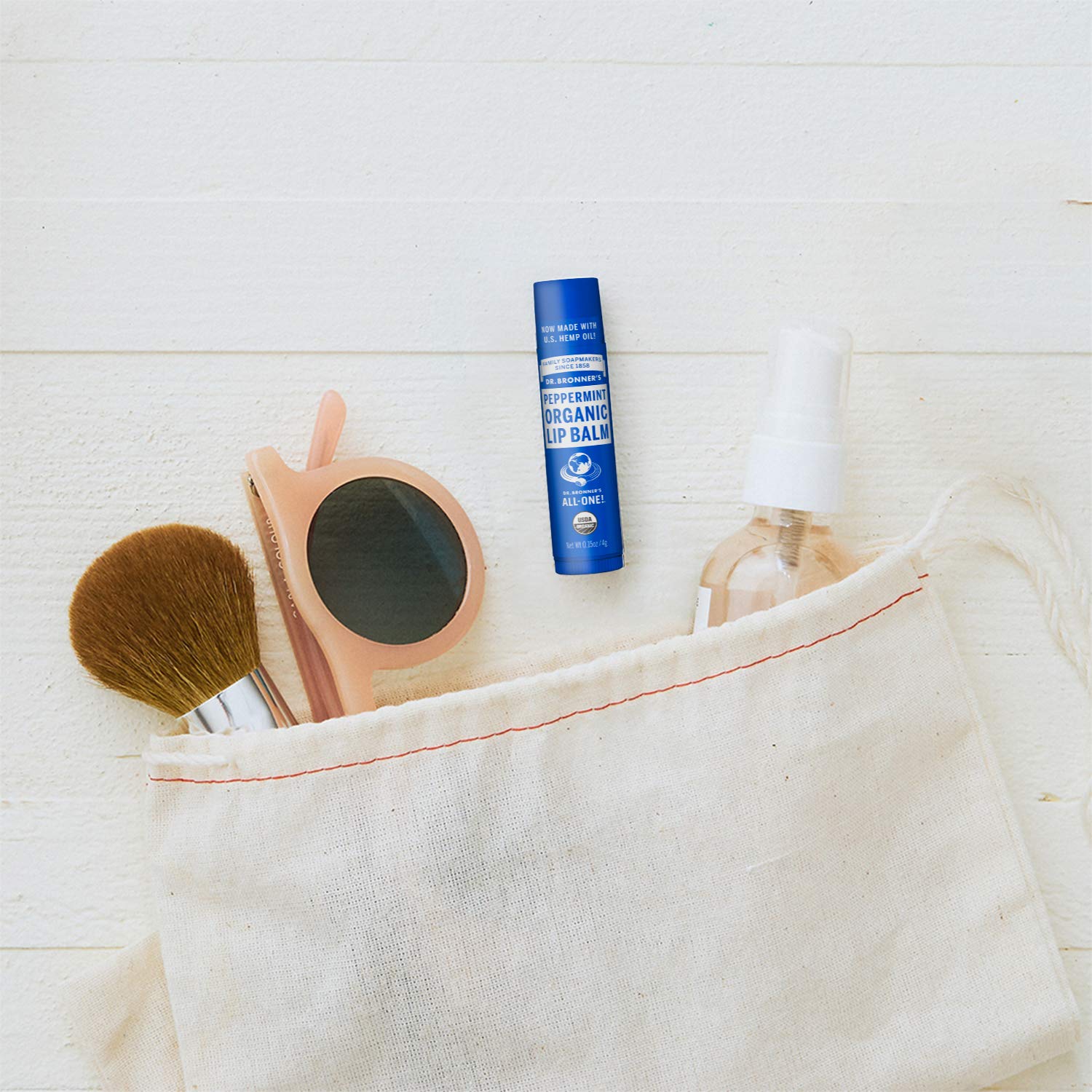 Dr. Bronner's Organic Lip Balm Naked Unscented tube for fragrance-free lip care.