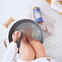 Dr. Bronner's Peppermint soap lather close-up—effortless foam for skin and hair