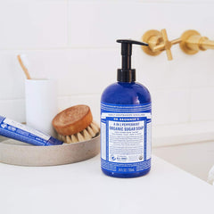 Dr. Bronner's Peppermint Sugar Soap hands foaming, indicating quick cleansing and minty aroma.