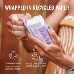 Dr. Bronner's bar packaging with recycled wrappers highlights eco-friendly materials.
