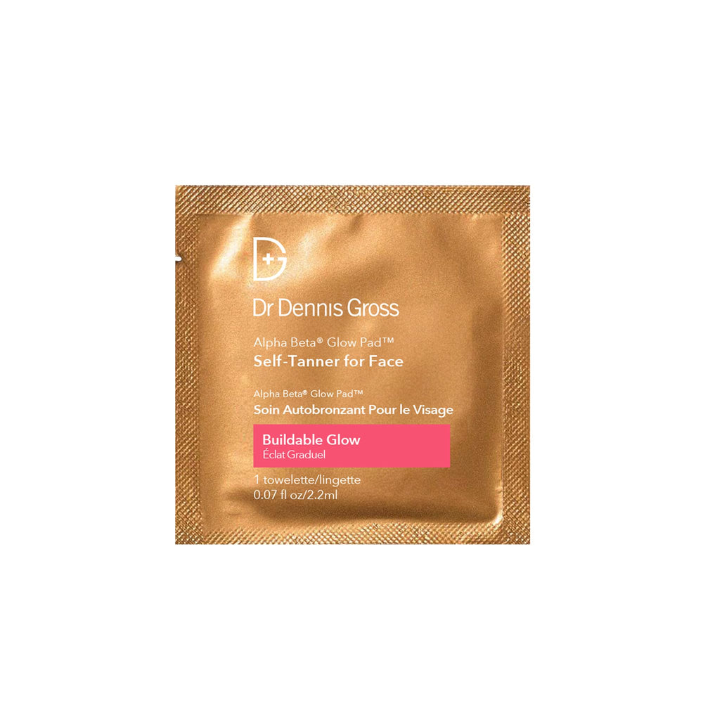 Dr Dennis Gross Glow Pad exfoliate closeup highlights AHAs and BHAs for smoother skin.