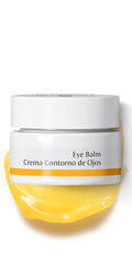Dr. Hauschka Eye Balm being gently patted under the eye for soothing use.