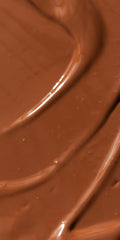 Dr. Hauschka Translucent Bronzing Tint application on cheeks delivers subtle, radiant warmth.