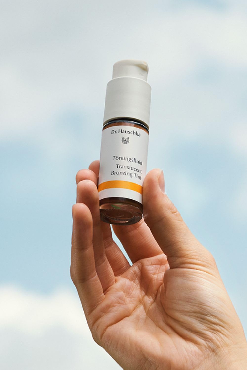 Dr. Hauschka Translucent Bronzing Tint uses mineral pigments for sunlit warmth on complexion.