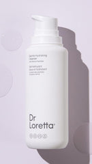 Dr. Loretta cleanser in use on the face illustrating a gentle cleansing massage