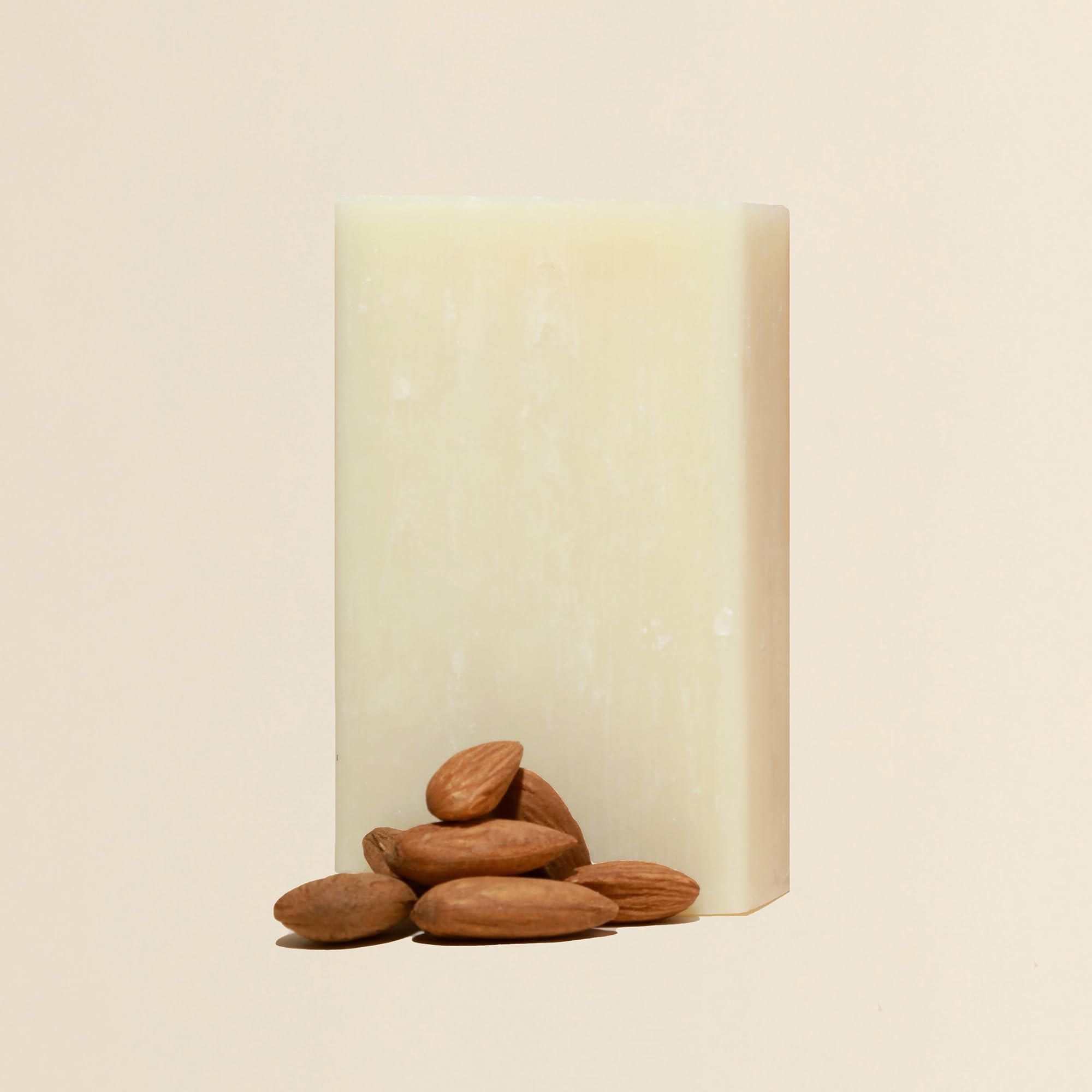 Dr. Natural Pure Castile Almond bar beside bathroom sink with soft lathering.