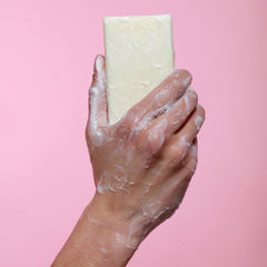 Dr. Natural Pure Castile Almond bar cruelty-free logo close-up emphasizes ethical care.