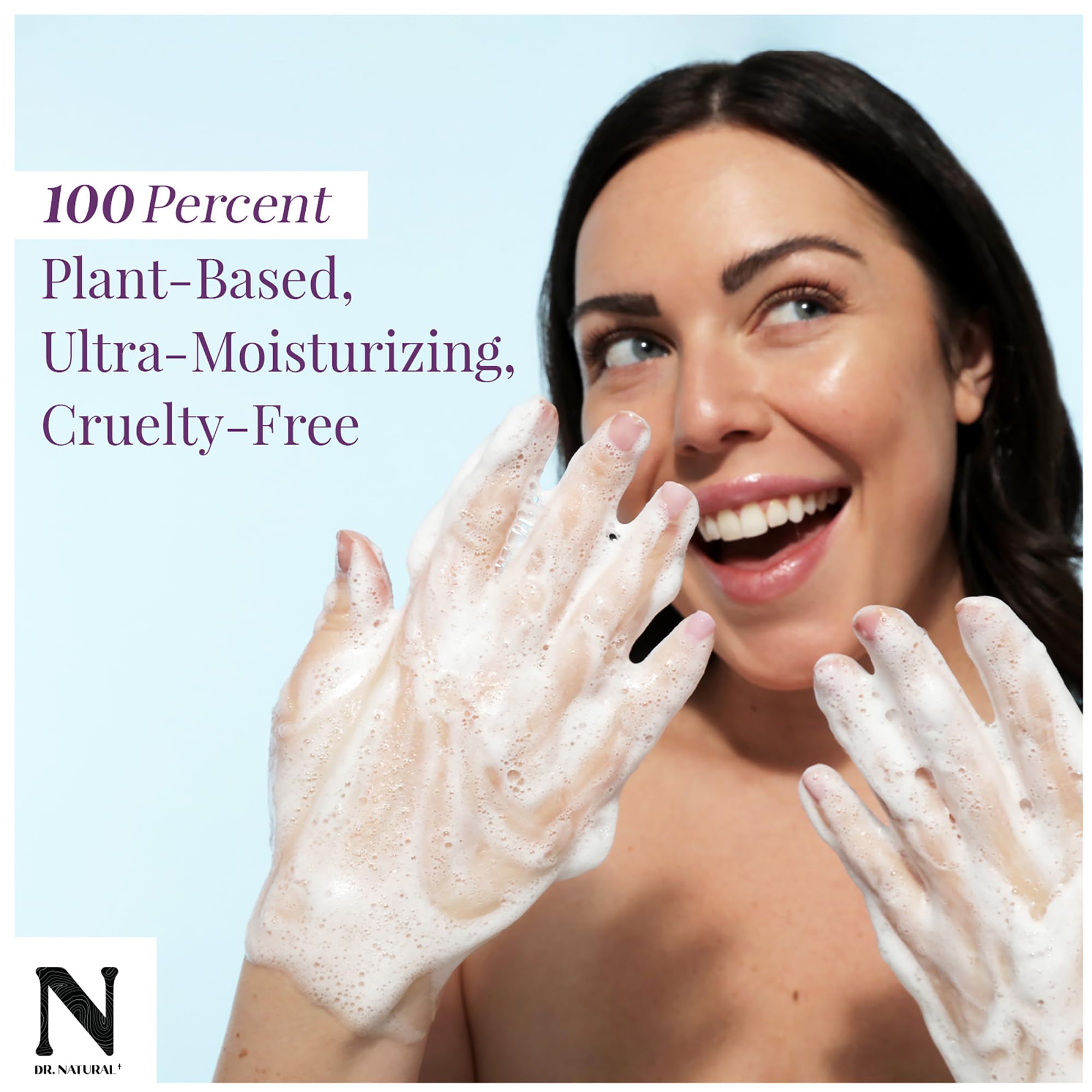 Dr. Natural Pure Castile Almond bar lather foaming in hand for gentle cleansing.
