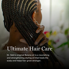 Dr. Sebi's Batana Oil applied to hair for a soft, silky finish.