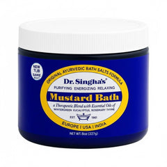 Dr. Singha's Mustard Bath Salts bottle in a spa setting for relaxation.