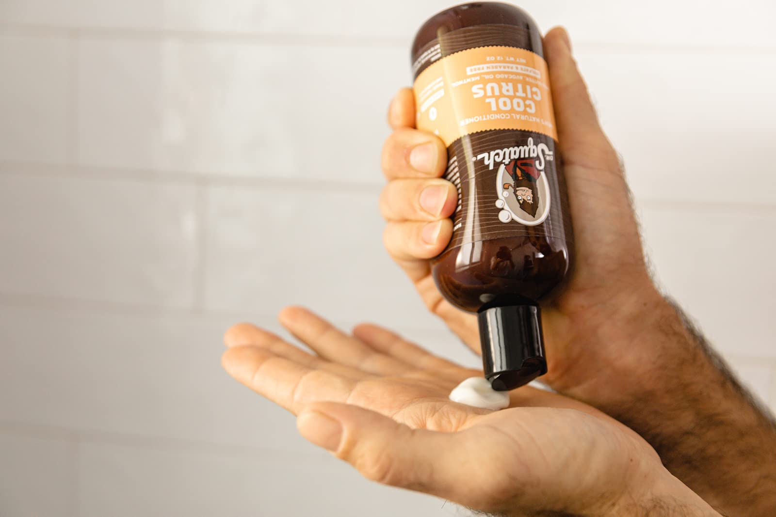 Dr. Squatch Cool Citrus Conditioner pour for easy application and lightweight hydration.