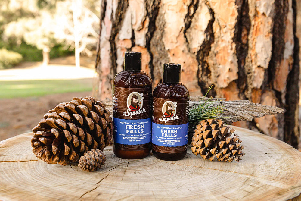 Dr. Squatch Fresh Falls Conditioner label closeup highlights burdock and tea tree for scalp comfort.