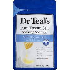 Dr Teal's Milk Protein & Honey epsom salt dissolving in water for a skin-softening soak.