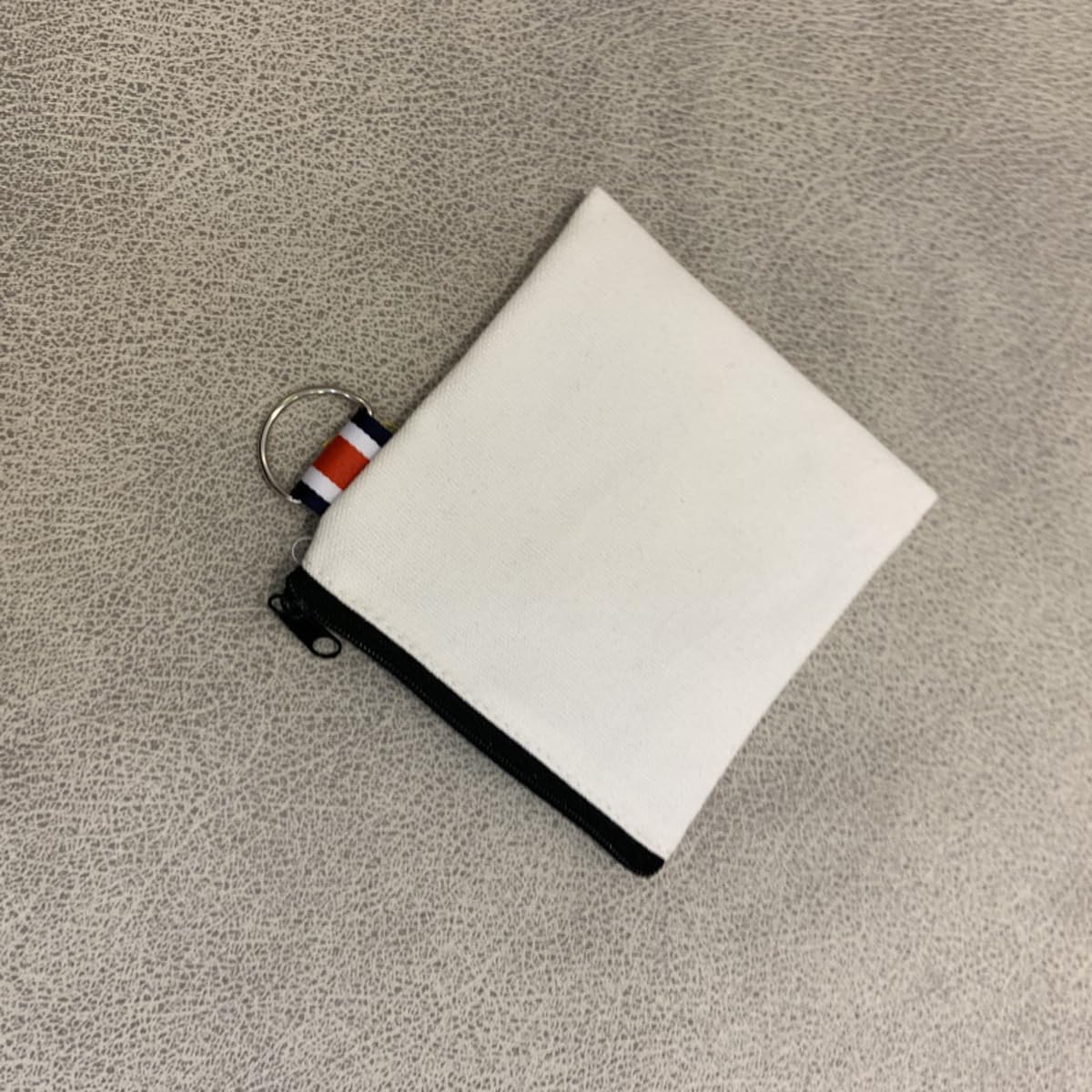 DraCra compact coin and earphone pouch keeps cables organized.