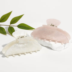 Drealoe white clip worn in daily outfits for a subtle elegant touch.