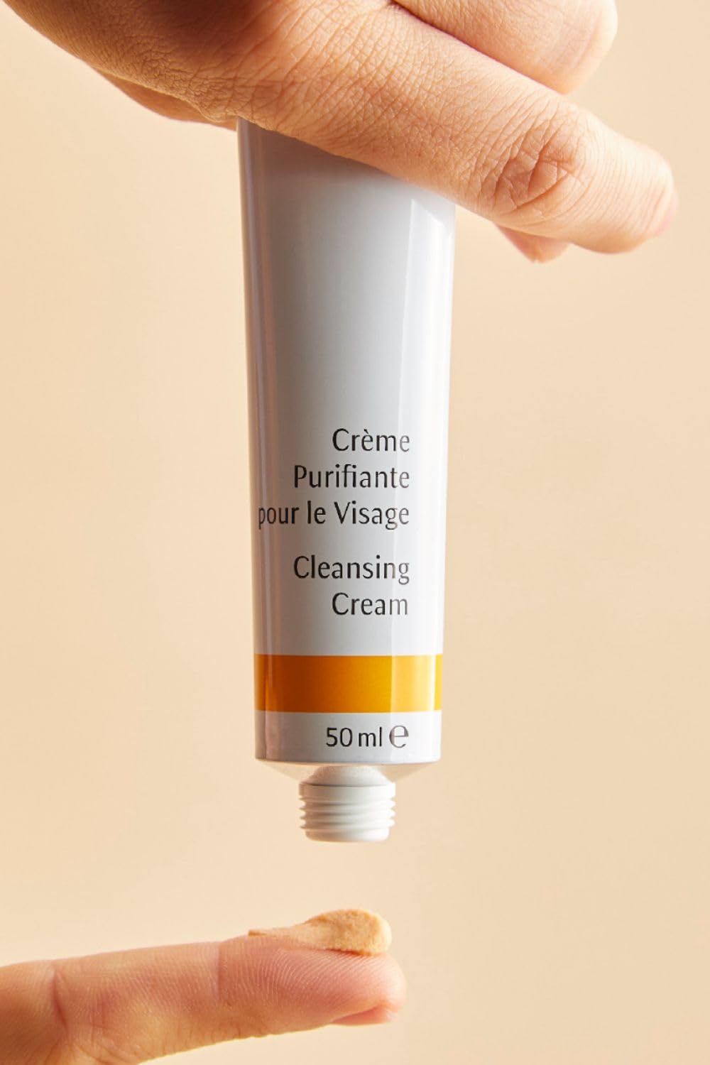 Dr. Hauschka Cleansing Cream bottle and toner-ready flow demonstrates routine preparation.