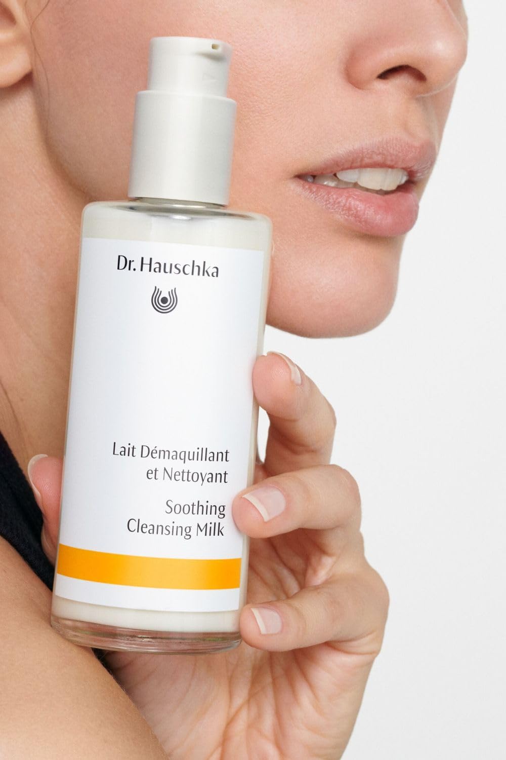 Dr. Hauschka soothing cleansing milk texture closeup shows creamy formula for sensitive skin.