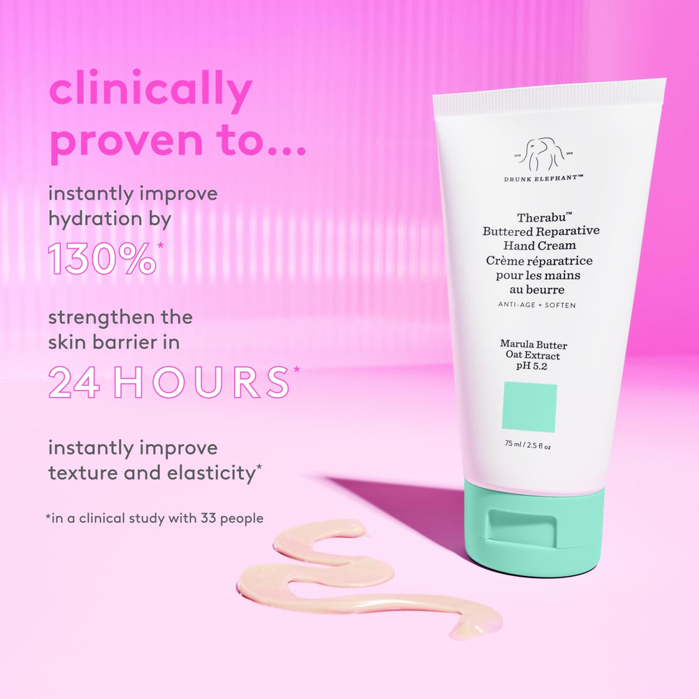Hands applying Drunk Elephant Therabu Buttered Hand Cream with smooth, even spread.