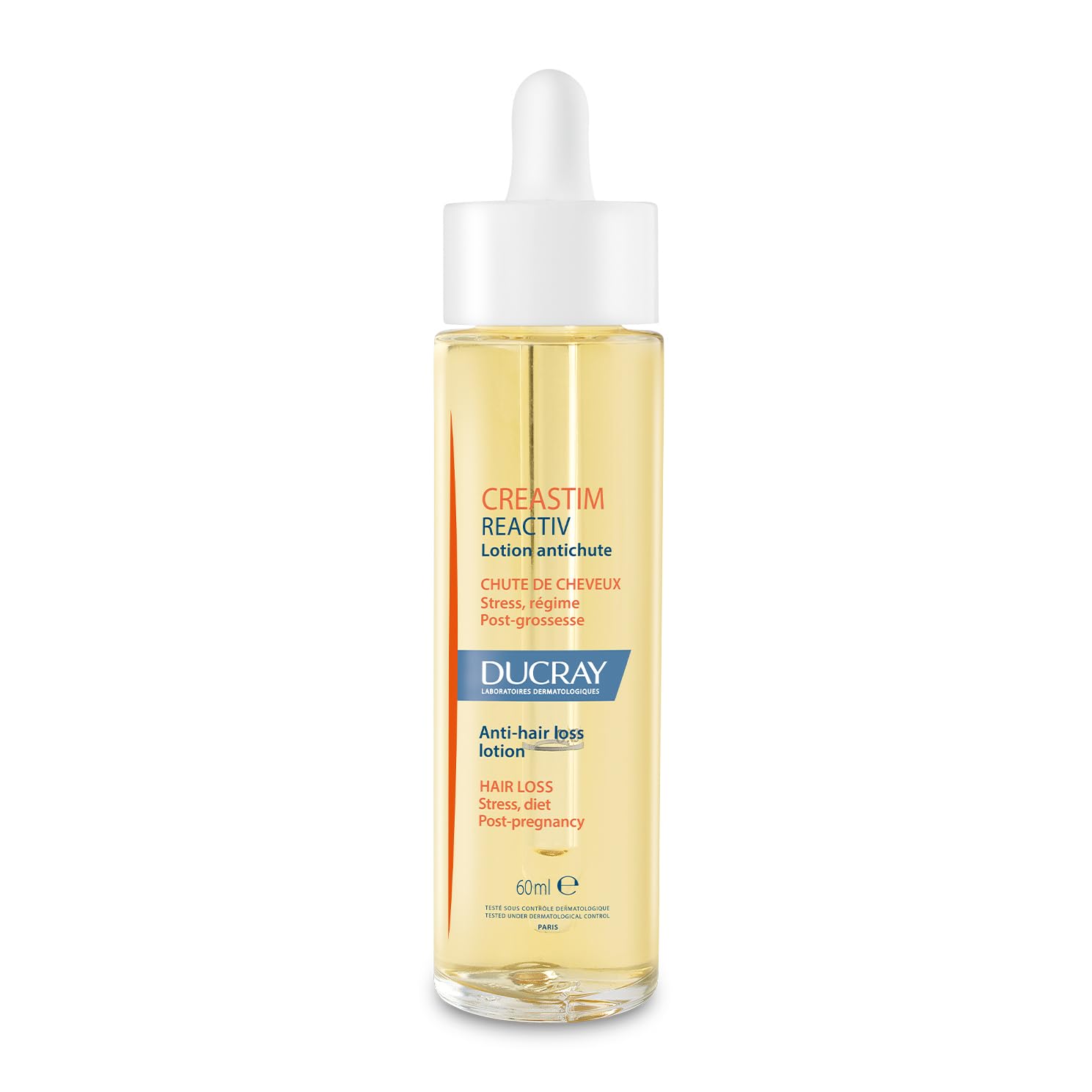 Ducray Creastim Reactiv hair lotion bottle on countertop for daily scalp support.