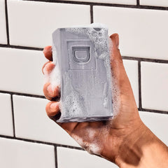 Duke Cannon big brick soap bars close-up shows coarse texture and lasting lather potential.