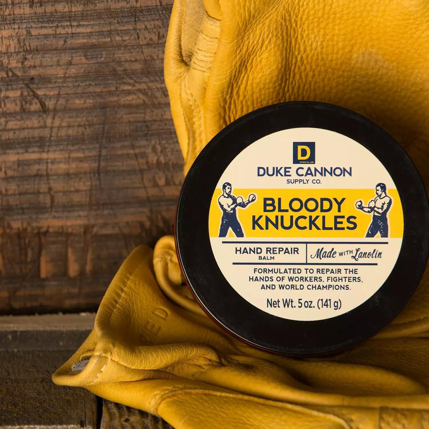 Duke Cannon Bloody Knuckles balm in rugged work setting supports durable hand care.