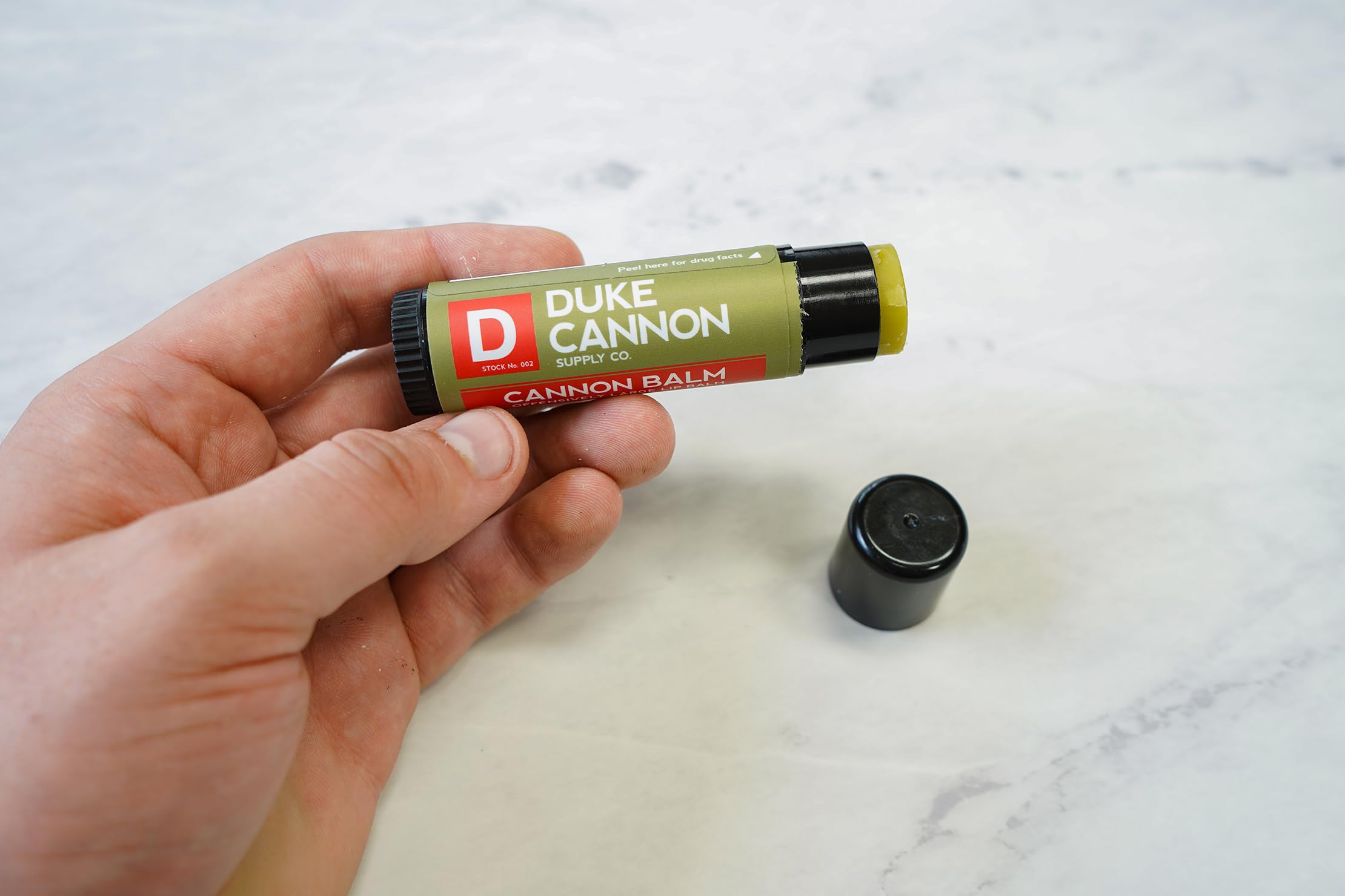 Duke Cannon Tactical Lip Protectant SPF 15 with fresh mint for all-day protection.