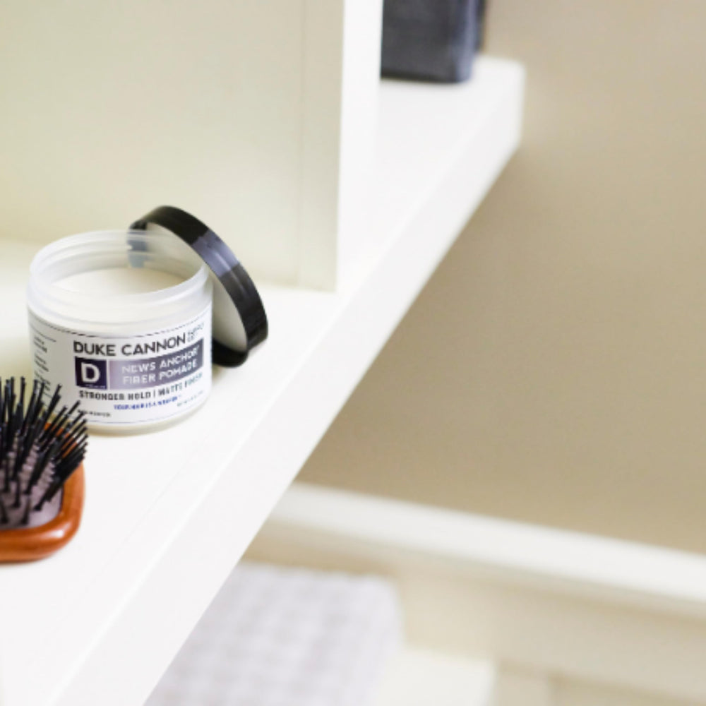 Duke Cannon News Anchor Pomade cedar sandalwood scent in a masculine vibe
