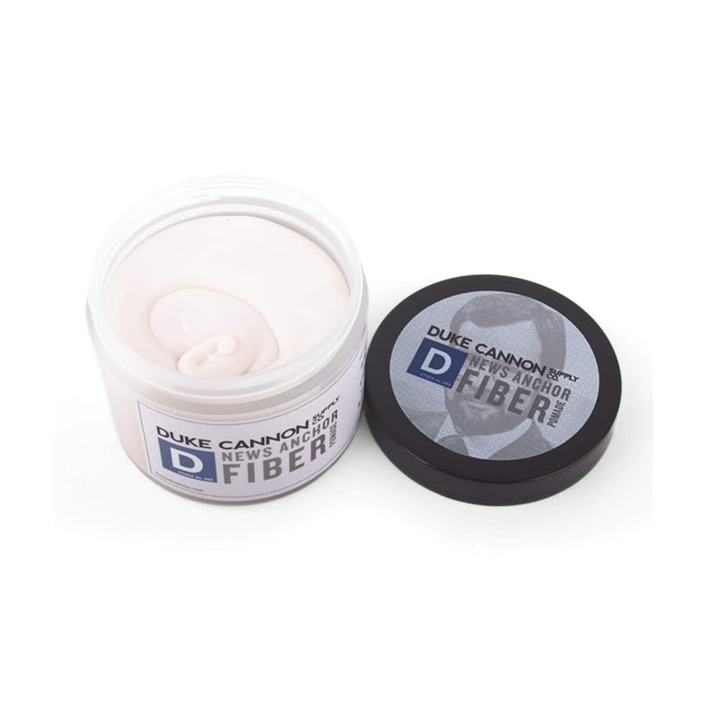 Duke Cannon News Anchor Pomade front tube shows compact, easy-to-apply styling
