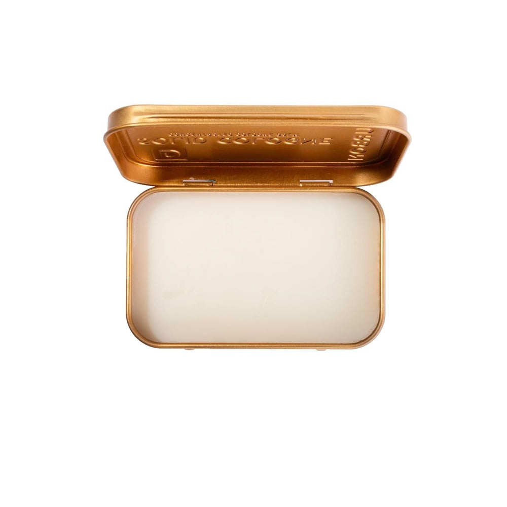Duke Cannon Bourbon solid cologne tin back highlighting travel-friendly packaging.