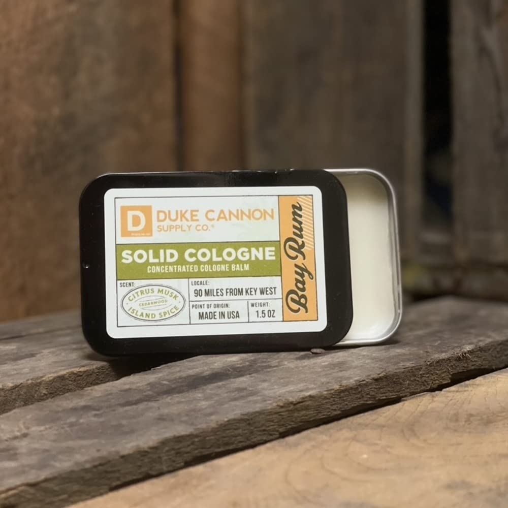 Duke Cannon Supply Co. Bay Rum tin side view highlights compact travel fragrance.