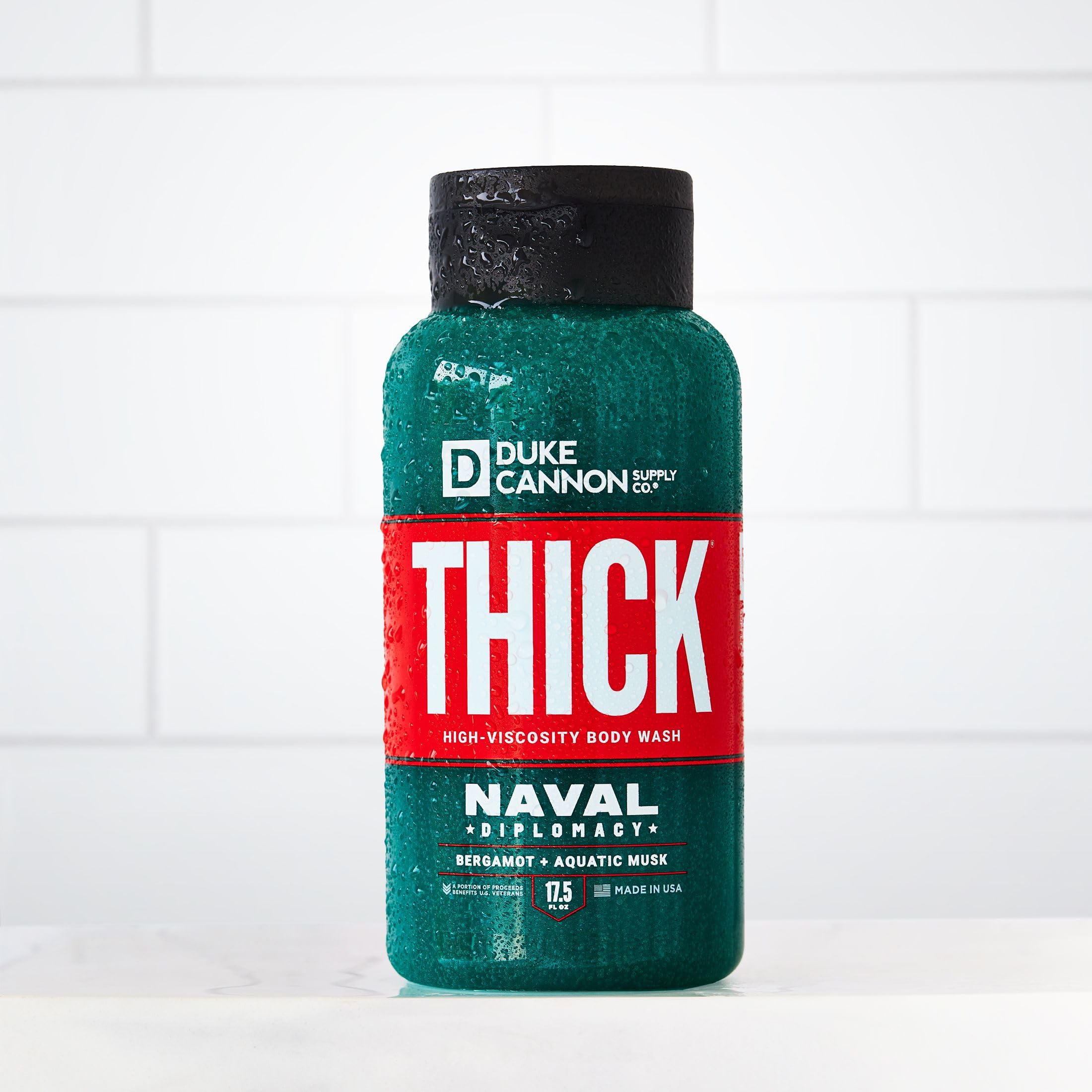 Duke Cannon THICK Naval Diplomacy body wash lather close-up for deep-clean feel.