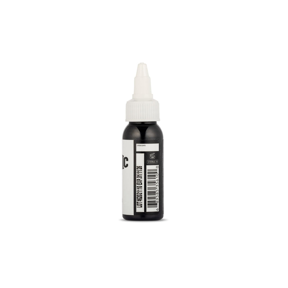 Dynamic Color Co. black tattoo ink being applied smoothly on skin.
