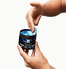E Elegance Vitamin Gel being applied for a firm, lasting style.