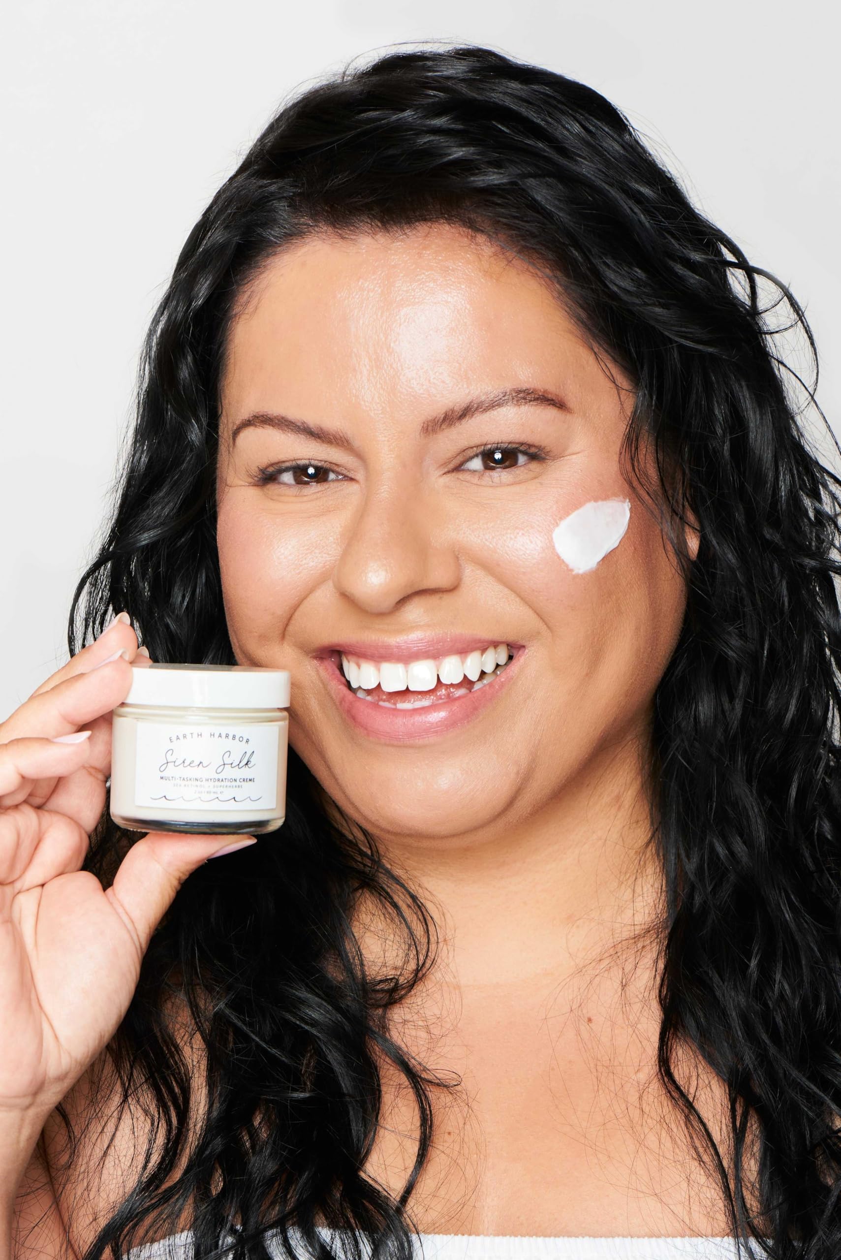 Earth Harbor SIREN SILK texture swirl highlights airy, creamy formulation for smooth skin.