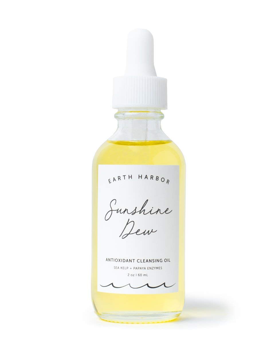 Earth Harbor Sunshine Dew cleanser bottle showing a bright non-greasy finish after makeup removal