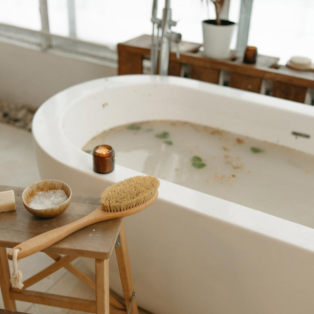 Calm bath scene featuring Earthborn Elements Lavender Epsom Salt.