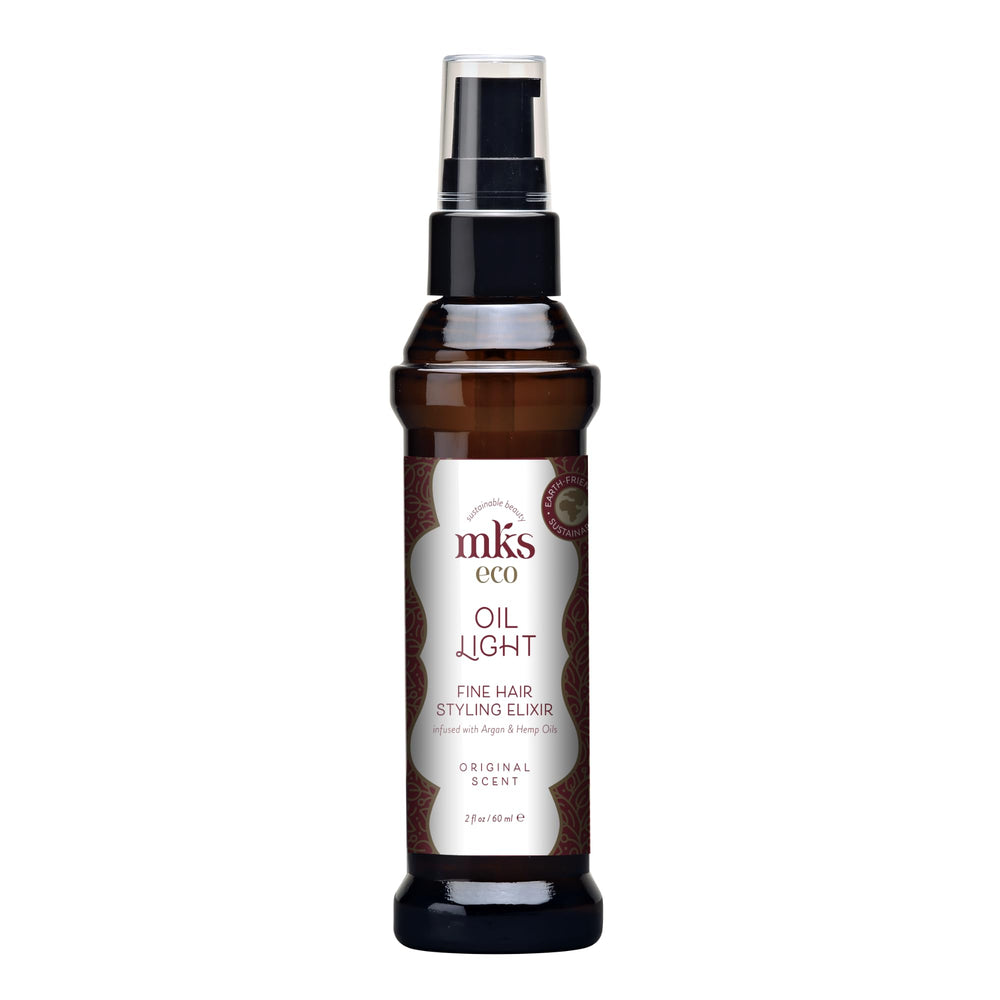 Earthly Body MKS Eco Hair Styling Elixir bottle close-up showing lightweight hydration for fine hair.