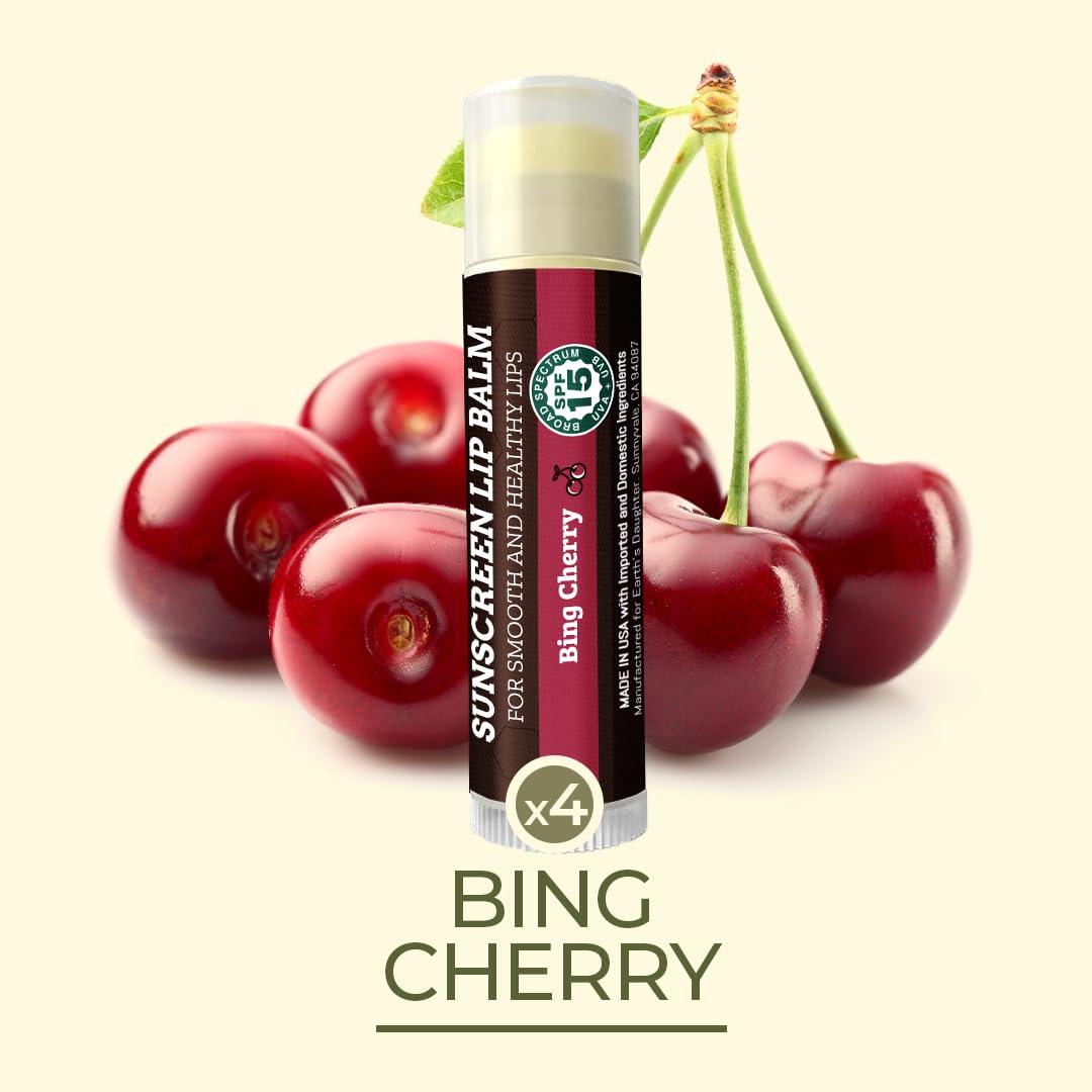 Cherry flavor lip balm on a sunny beach bag, ready for lip care on the go.