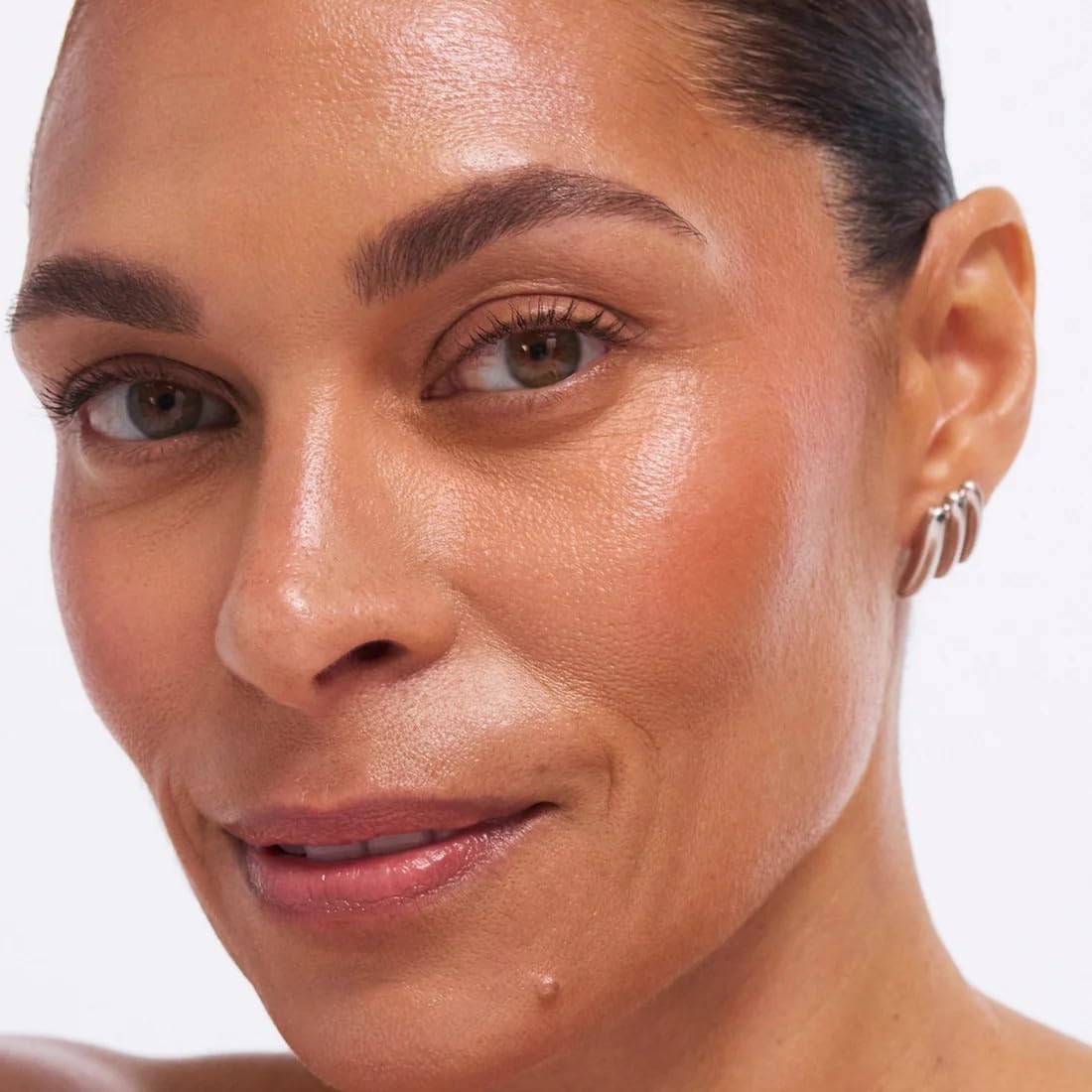 EarthsCure Glow Trio arm swatches; buildable color on skin.