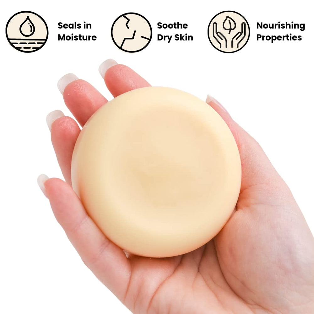 Eco Roots vegan lotion bar on hand shows easy rub-in hydration for dry skin.