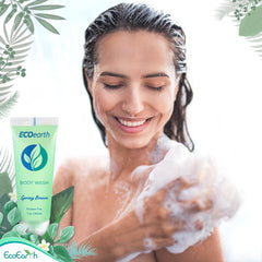 EcoEarth travel-size bottle shown in a hotel bathroom setup.
