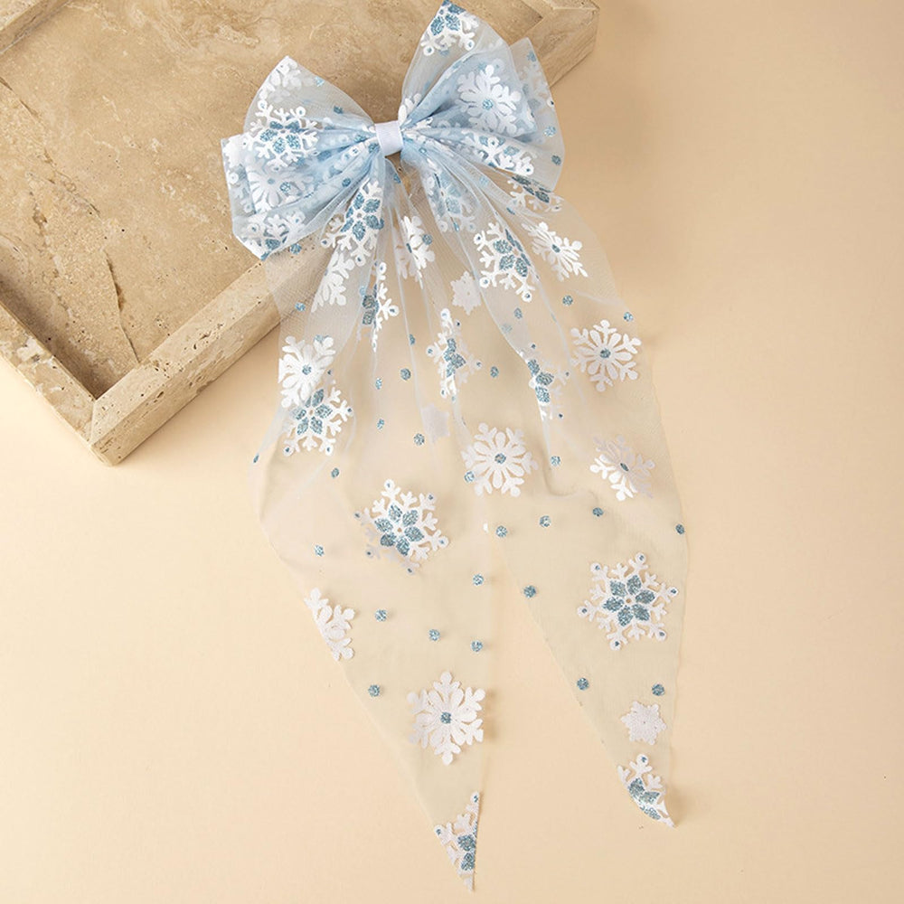Ecuupas lace snowflake bow clip in blue and white closeup for winter outfits