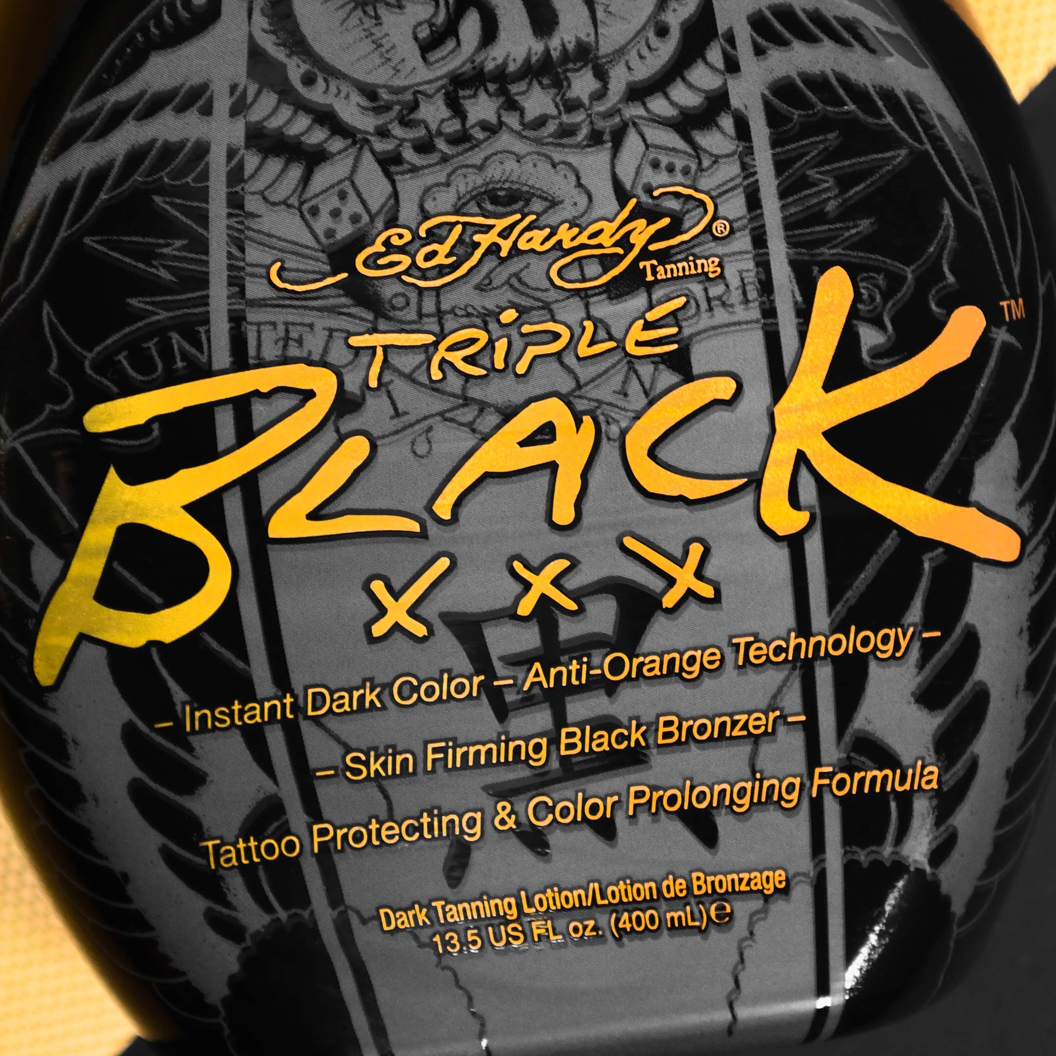 Ed Hardy Black XXX blue tansy protects tattoo color and fade during tanning.