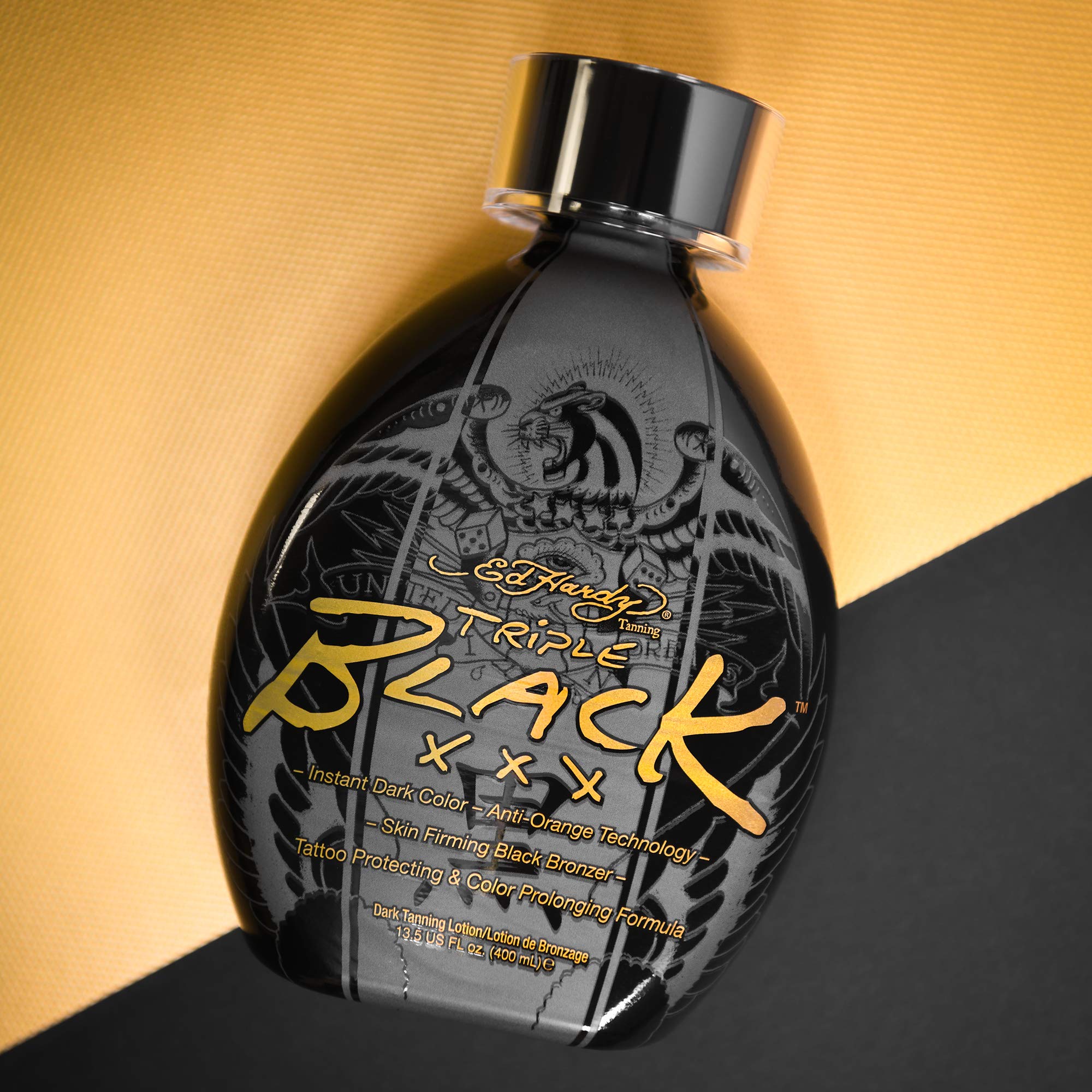 Ed Hardy Black XXX on skin during application for a fast, even tan look.