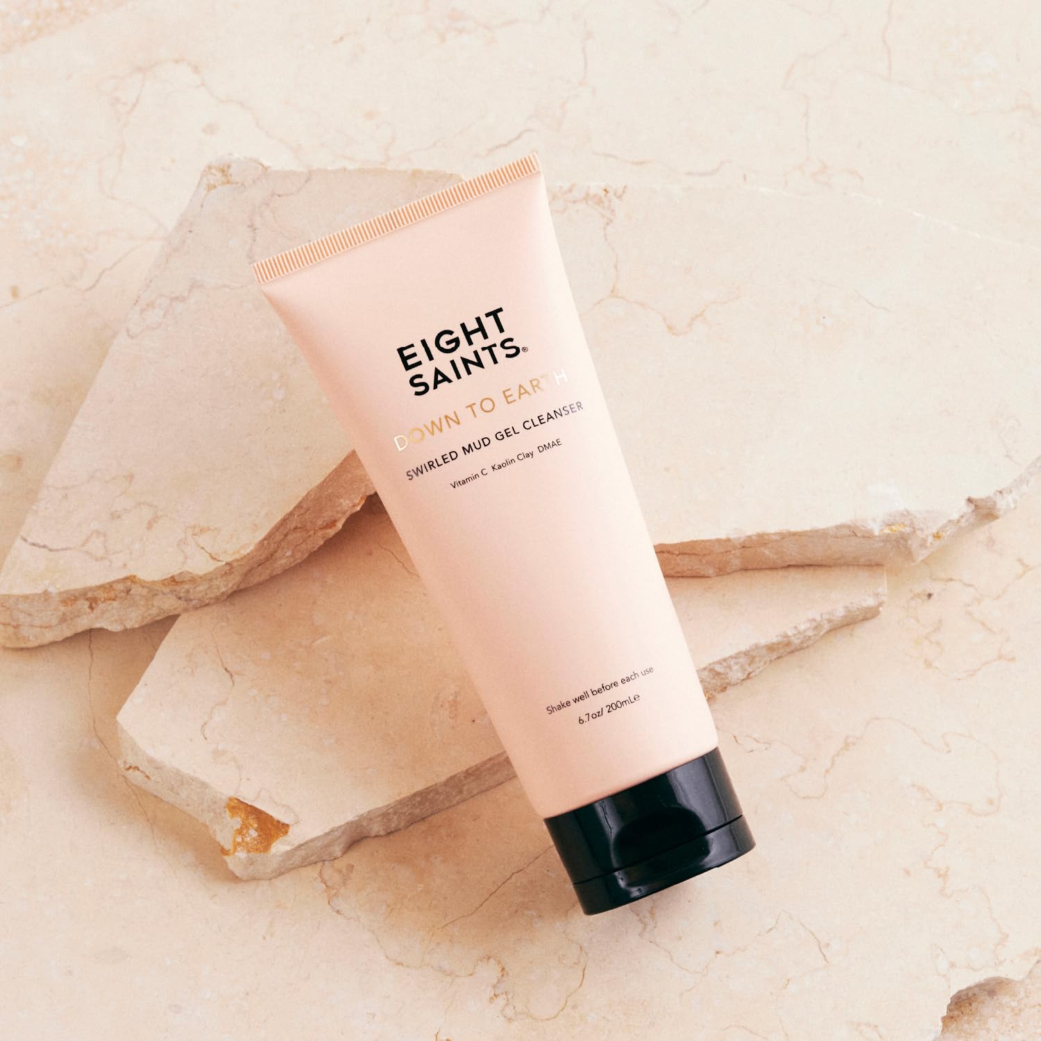 Eight Saints ingredients close-up featuring Vitamin C and clays for brightening.