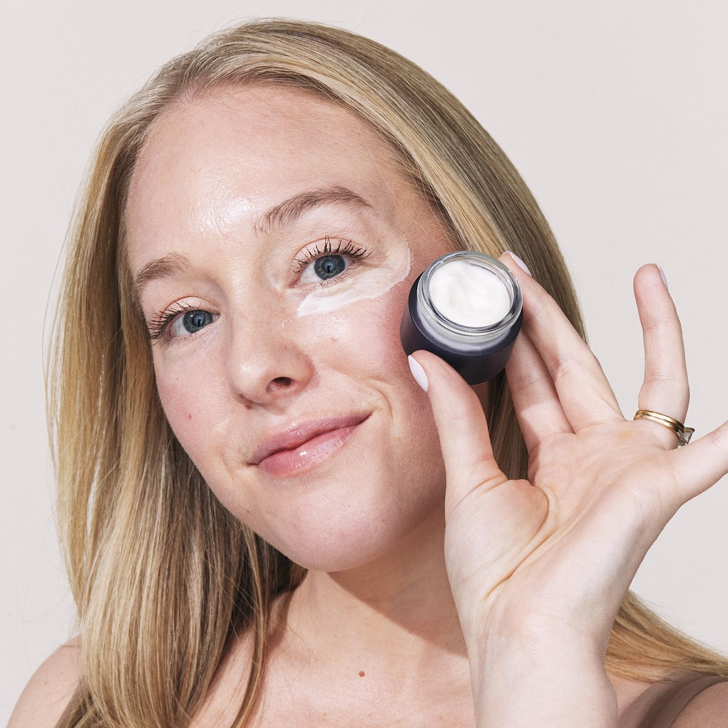 Eight Saints Retinol Eye Cream being applied with fingertips illustrating quick-absorbing texture